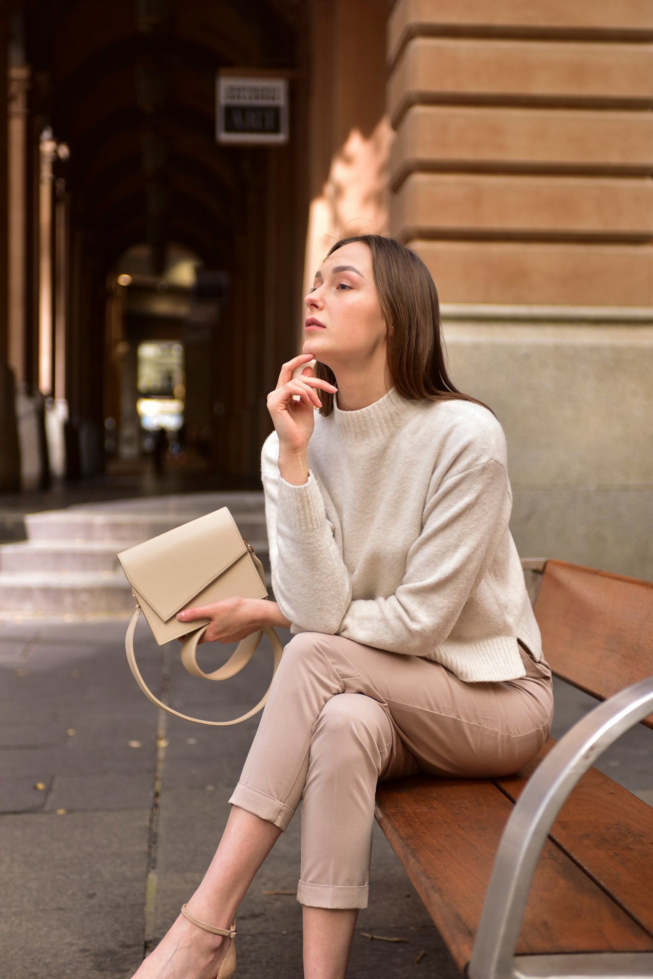 Beige leather clutch handbag