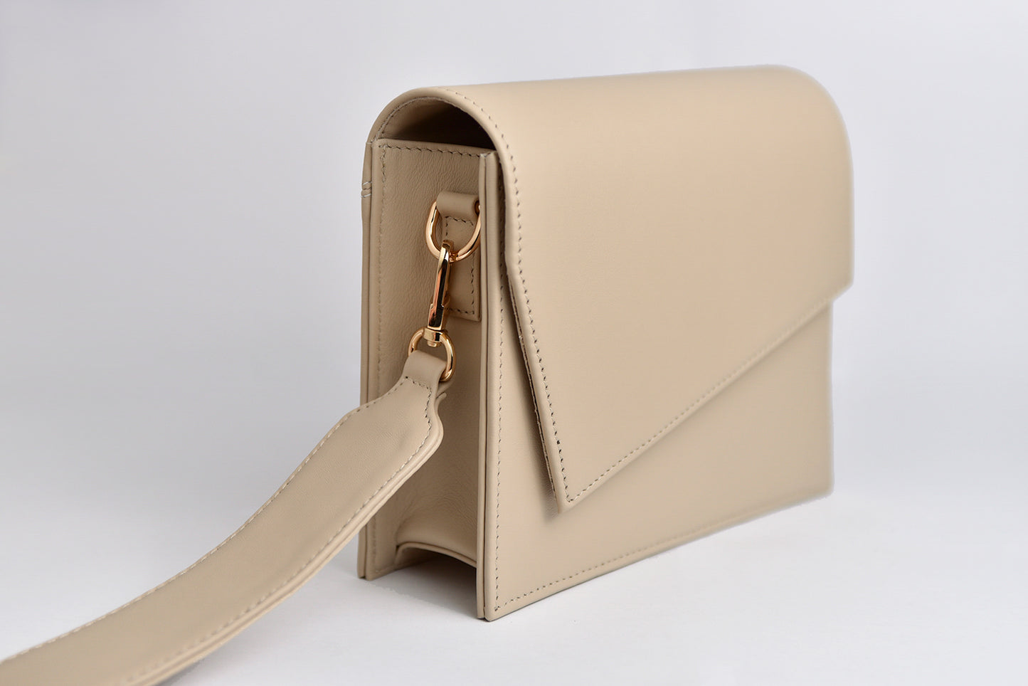 Beige leather clutch handbag
